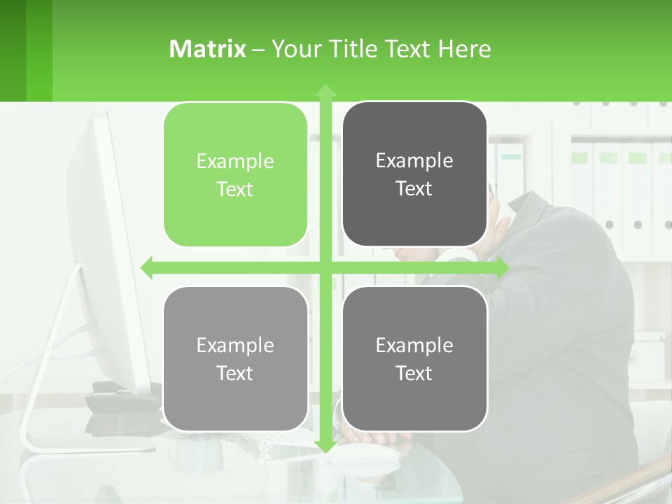 A Man Sitting At A Desk In Front Of A Computer PowerPoint Template
