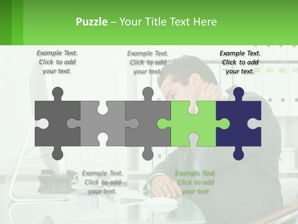 A Man Sitting At A Desk In Front Of A Computer PowerPoint Template