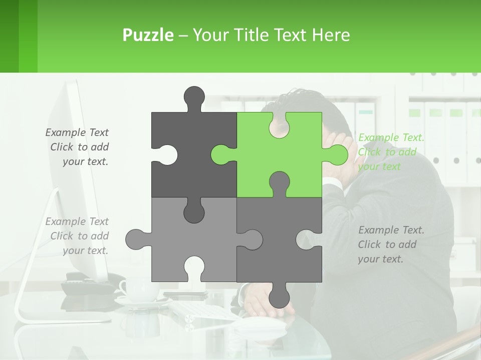 A Man Sitting At A Desk In Front Of A Computer PowerPoint Template