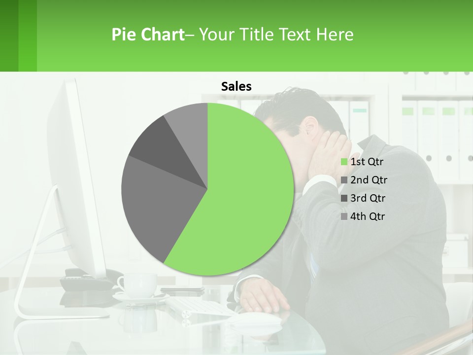 A Man Sitting At A Desk In Front Of A Computer PowerPoint Template
