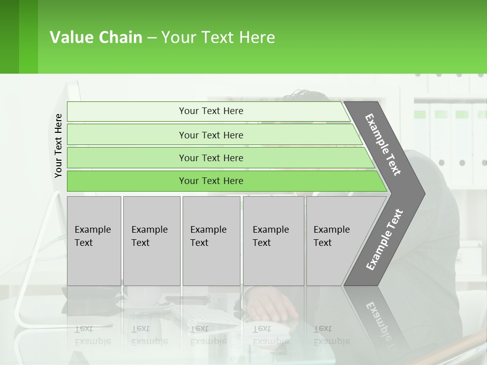 A Man Sitting At A Desk In Front Of A Computer PowerPoint Template