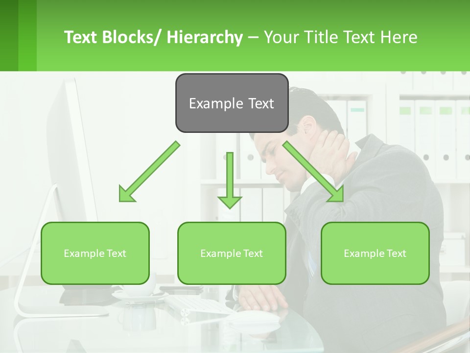 A Man Sitting At A Desk In Front Of A Computer PowerPoint Template