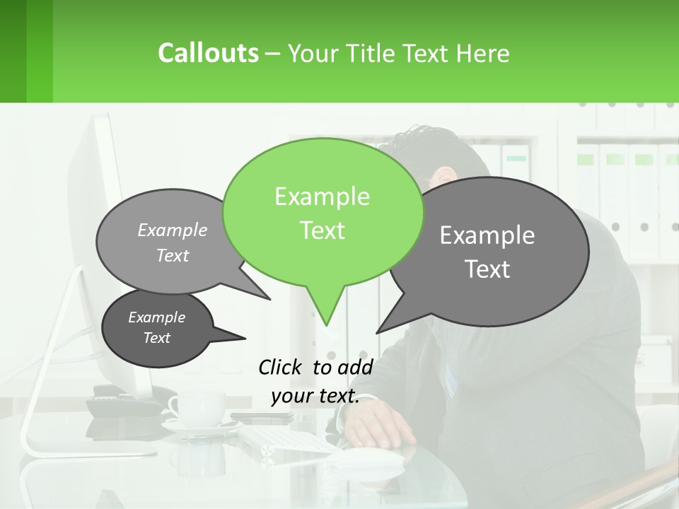 A Man Sitting At A Desk In Front Of A Computer PowerPoint Template