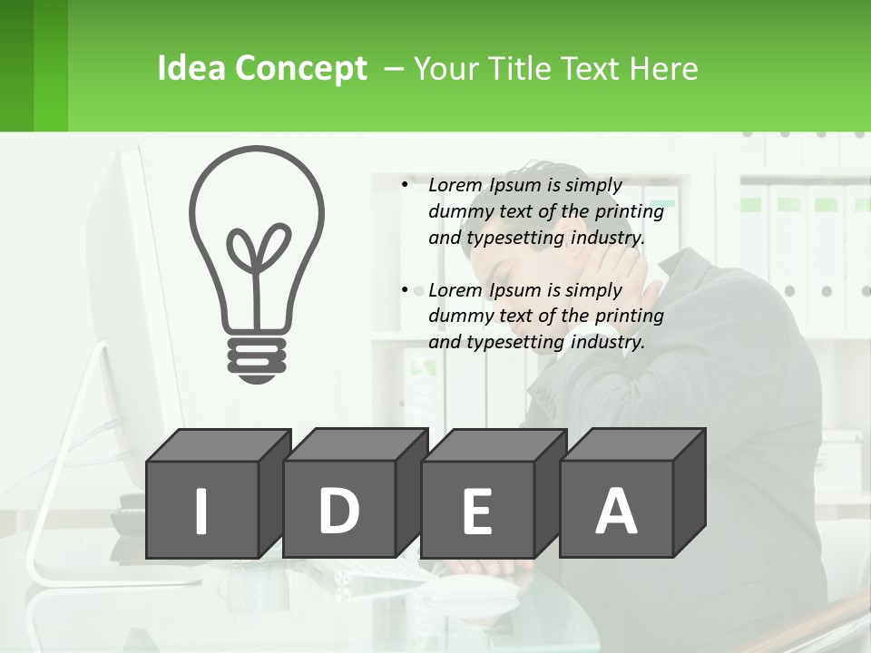 A Man Sitting At A Desk In Front Of A Computer PowerPoint Template