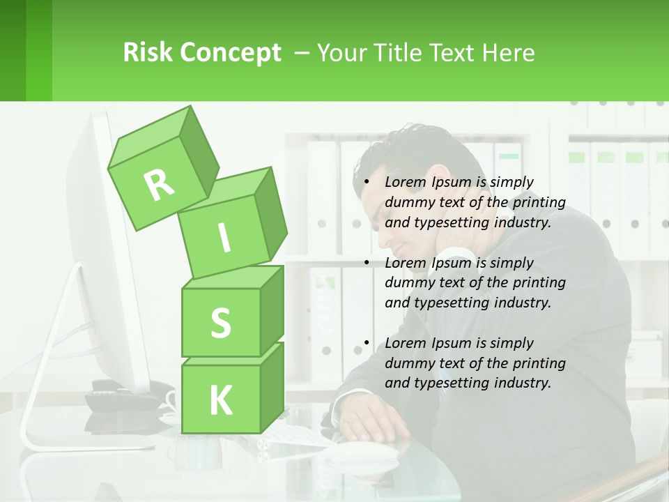 A Man Sitting At A Desk In Front Of A Computer PowerPoint Template