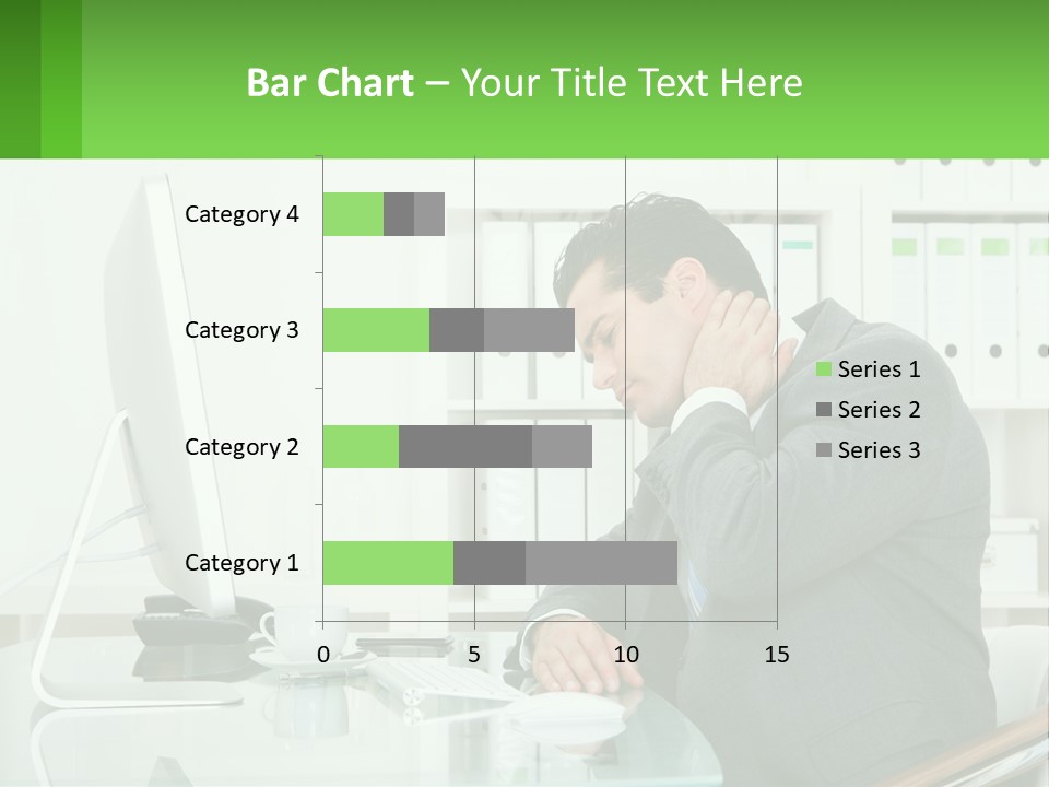 A Man Sitting At A Desk In Front Of A Computer PowerPoint Template