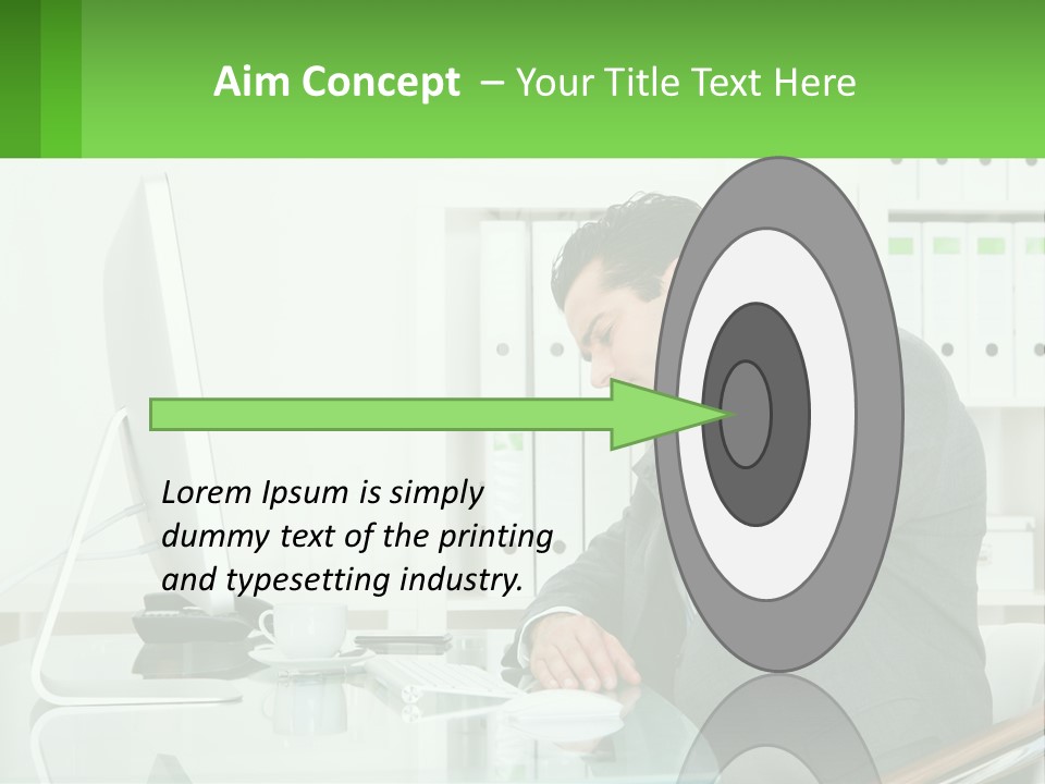 A Man Sitting At A Desk In Front Of A Computer PowerPoint Template