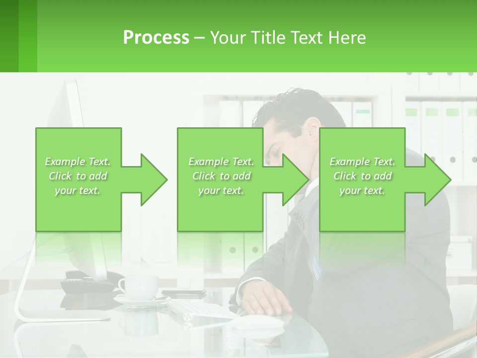 A Man Sitting At A Desk In Front Of A Computer PowerPoint Template