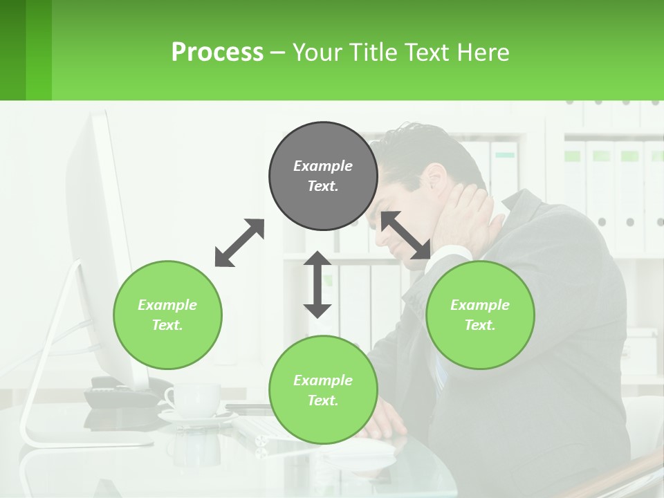 A Man Sitting At A Desk In Front Of A Computer PowerPoint Template