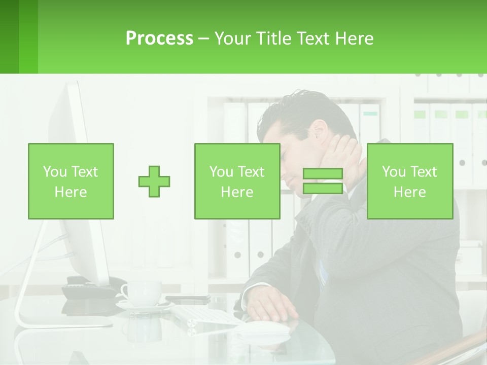 A Man Sitting At A Desk In Front Of A Computer PowerPoint Template