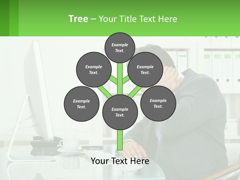 A Man Sitting At A Desk In Front Of A Computer PowerPoint Template