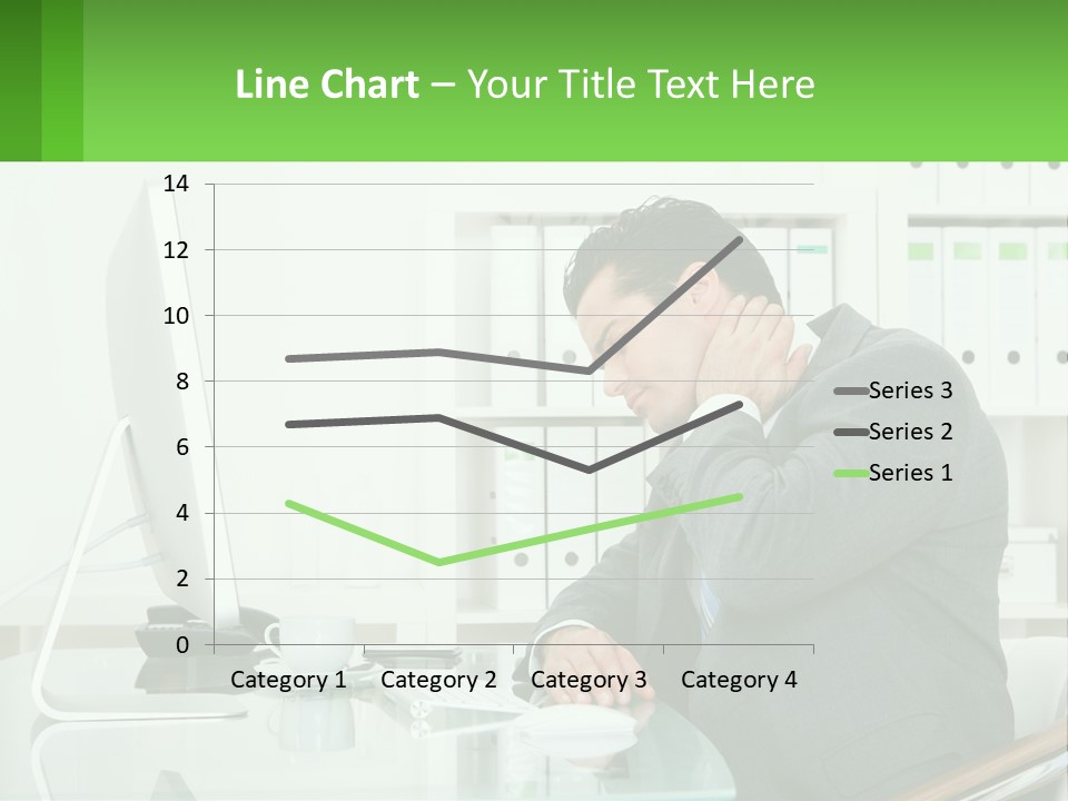 A Man Sitting At A Desk In Front Of A Computer PowerPoint Template