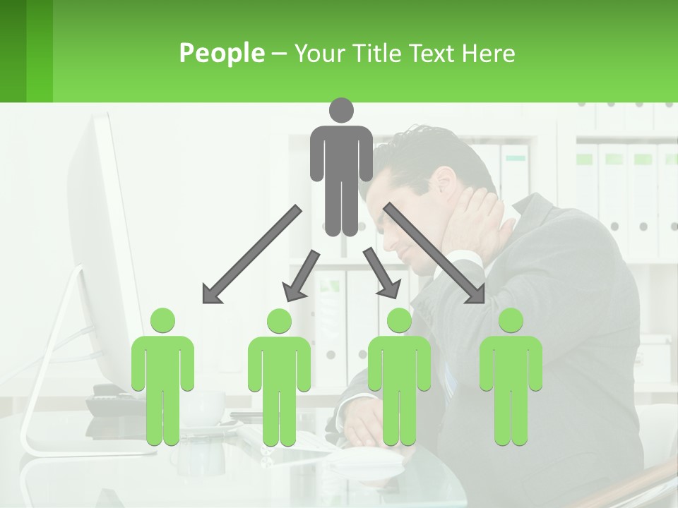 A Man Sitting At A Desk In Front Of A Computer PowerPoint Template