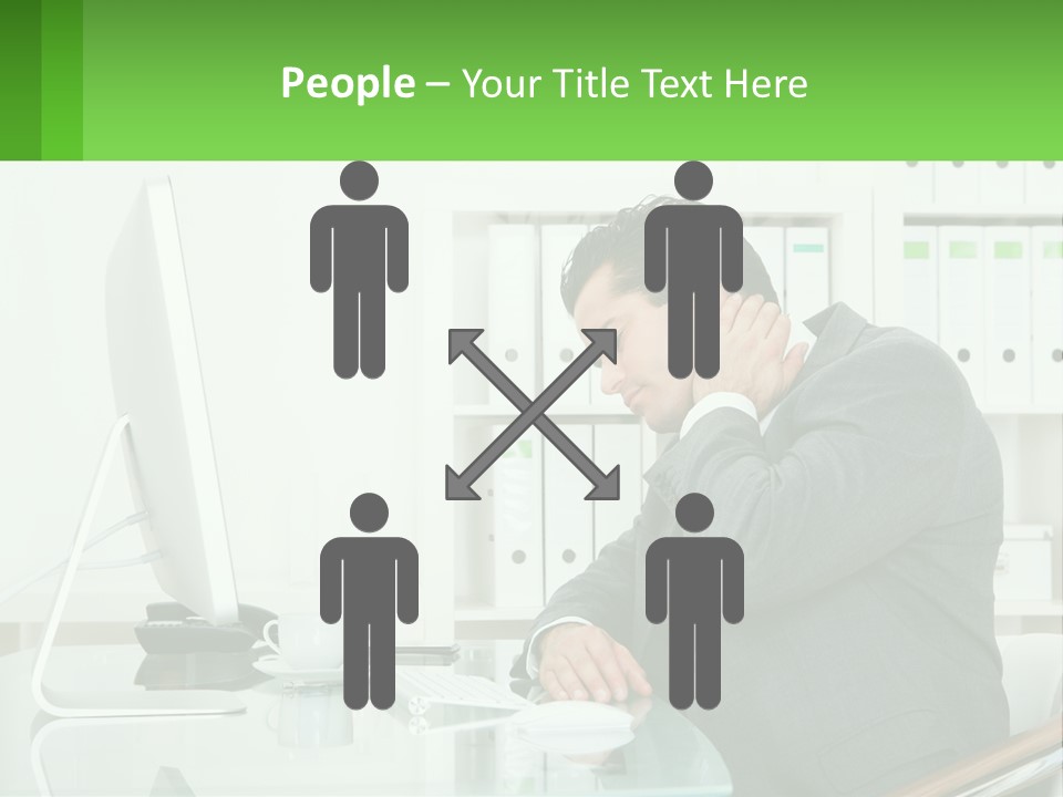 A Man Sitting At A Desk In Front Of A Computer PowerPoint Template