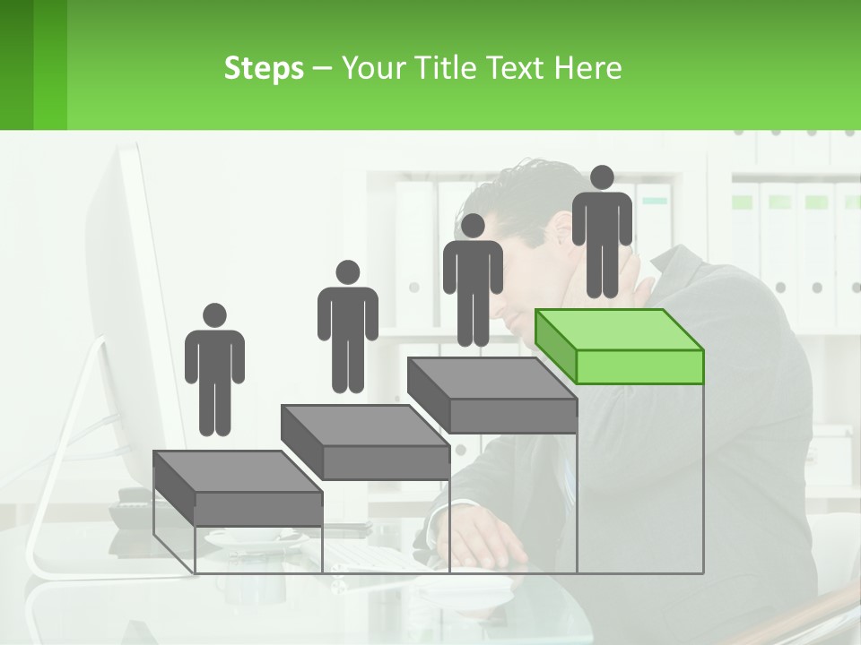 A Man Sitting At A Desk In Front Of A Computer PowerPoint Template