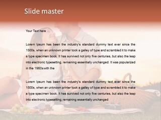 A Man And A Woman Sitting On A Blanket With A Bottle Of Champagne PowerPoint Template