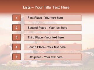 A Man And A Woman Sitting On A Blanket With A Bottle Of Champagne PowerPoint Template