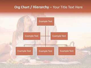 A Man And A Woman Sitting On A Blanket With A Bottle Of Champagne PowerPoint Template