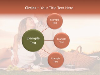 A Man And A Woman Sitting On A Blanket With A Bottle Of Champagne PowerPoint Template