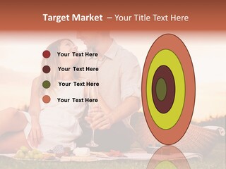 A Man And A Woman Sitting On A Blanket With A Bottle Of Champagne PowerPoint Template