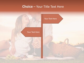 A Man And A Woman Sitting On A Blanket With A Bottle Of Champagne PowerPoint Template