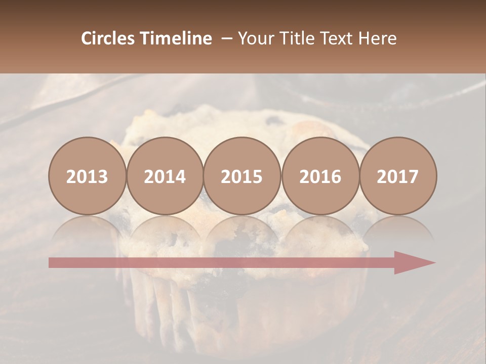 A Blueberry Muffin Sitting On Top Of A Wooden Table PowerPoint Template