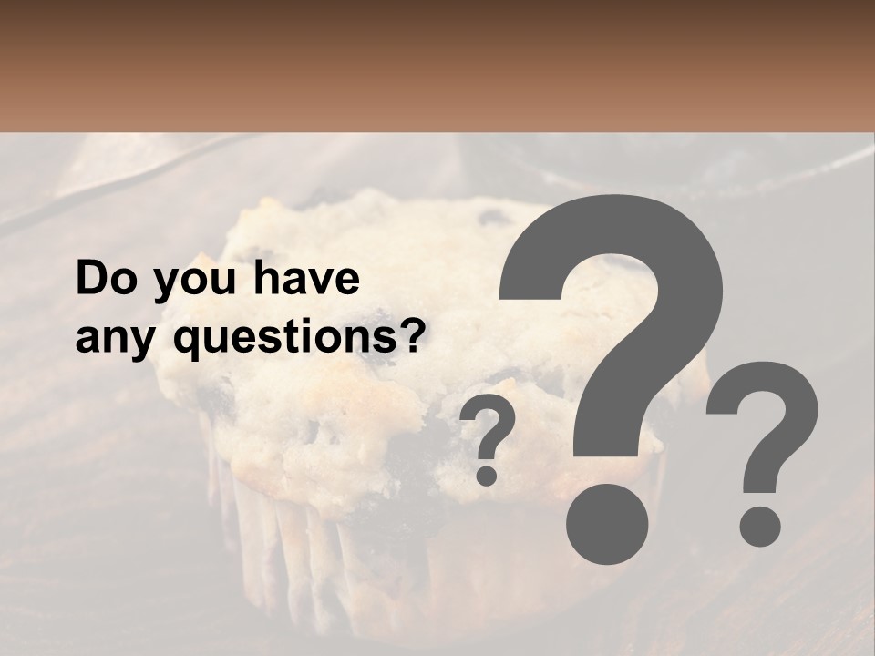 A Blueberry Muffin Sitting On Top Of A Wooden Table PowerPoint Template