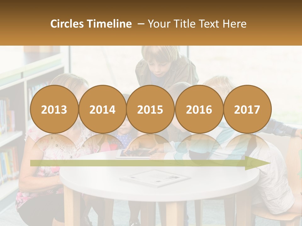 A Group Of Children Sitting Around A Table PowerPoint Template