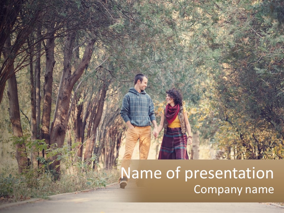 A Man And Woman Walking Down A Road Holding Hands PowerPoint Template