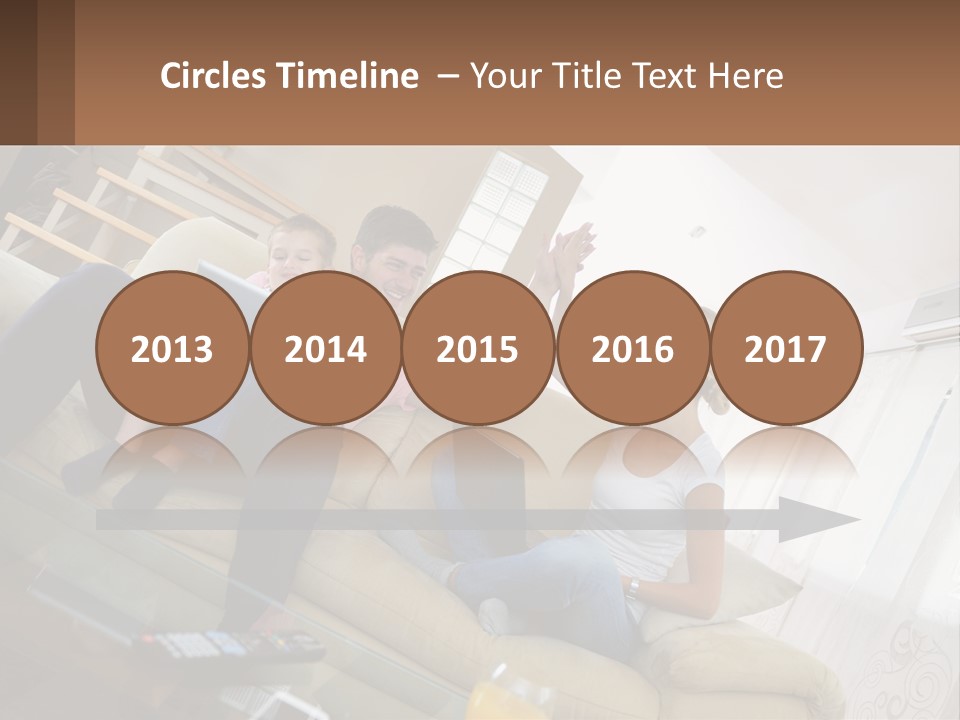 A Man And Woman Sitting On A Couch With A Child PowerPoint Template