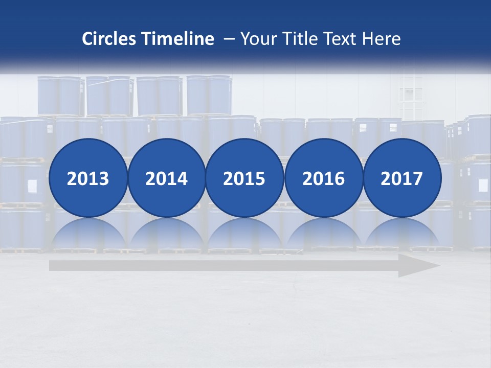 A Large Stack Of Blue Barrels In A Warehouse PowerPoint Template