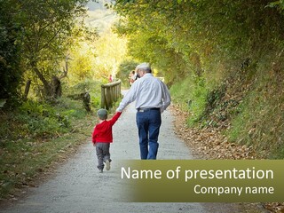 A Man And A Child Walking Down A Path Holding Hands PowerPoint Template