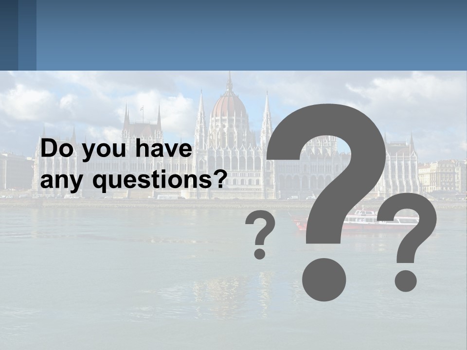 A Red Boat Is In The Water Near A Large Building PowerPoint Template