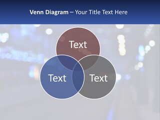 A Blurry Photo Of A City Street At Night PowerPoint Template