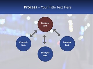 A Blurry Photo Of A City Street At Night PowerPoint Template
