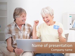 A Man And Woman Sitting On A Couch Holding A Credit Card PowerPoint Template