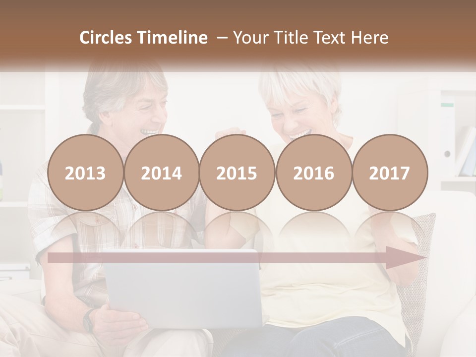 A Man And Woman Sitting On A Couch Holding A Credit Card PowerPoint Template