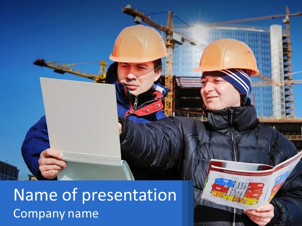 Two Men In Hard Hats Are Looking At A Blueprint PowerPoint Template