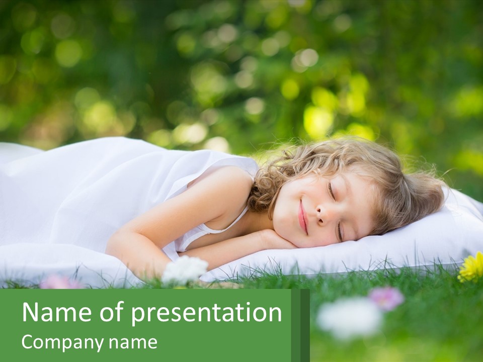 A Little Girl Is Sleeping On A Blanket In The Grass PowerPoint Template