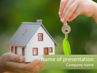 A Person Holding A Key To A House PowerPoint Template