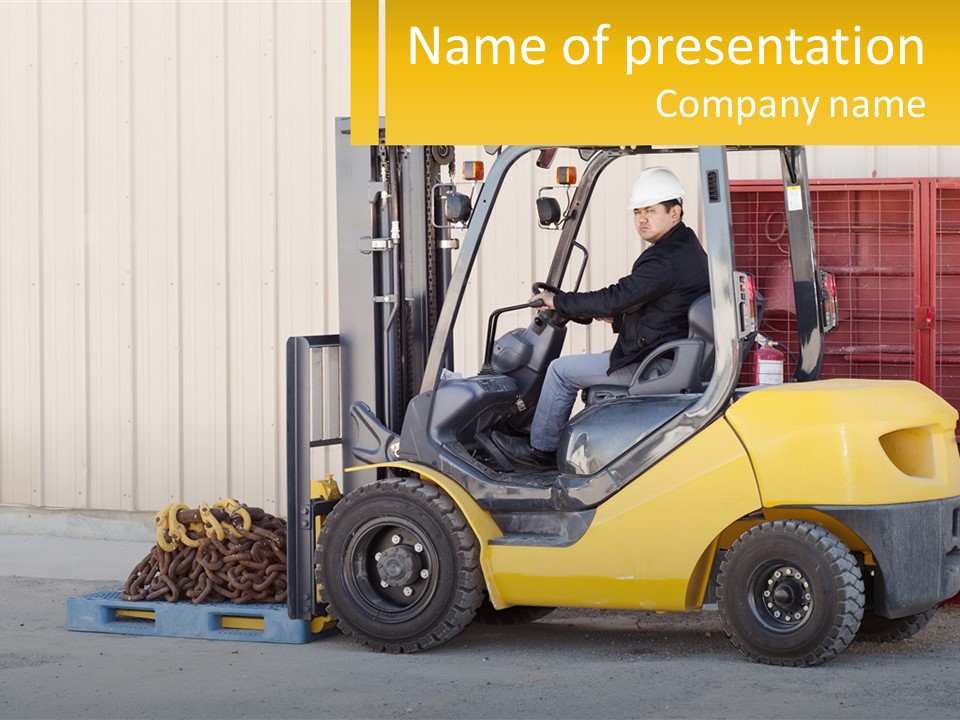 A Man Driving A Forklift Next To A Building PowerPoint Template