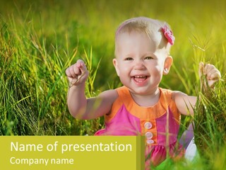 A Little Girl Sitting In The Grass With Her Hands Up PowerPoint Template
