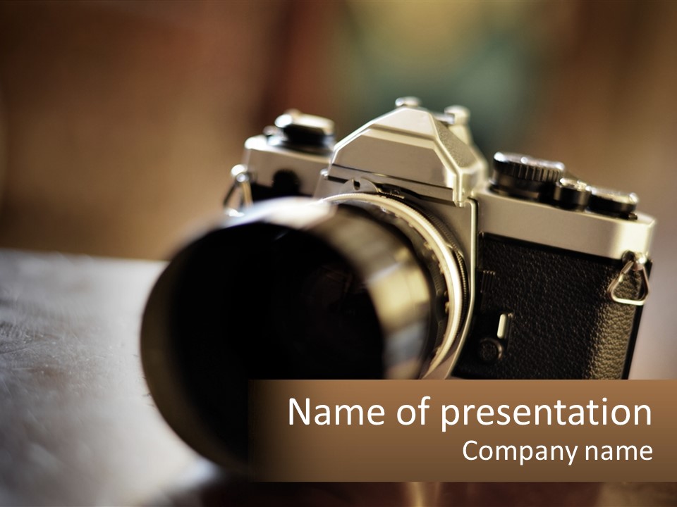 A Camera Sitting On Top Of A Wooden Table PowerPoint Template