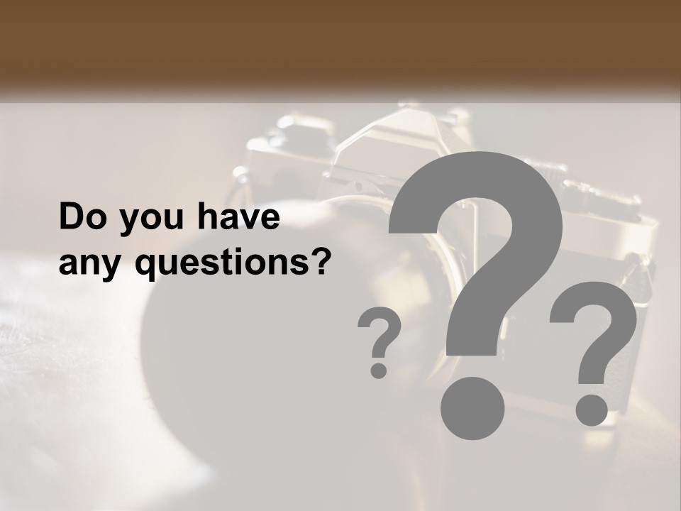 A Camera Sitting On Top Of A Wooden Table PowerPoint Template