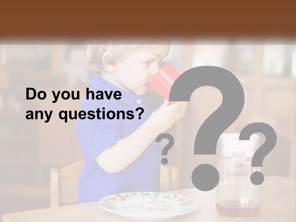 A Little Boy Drinking From A Red Cup PowerPoint Template