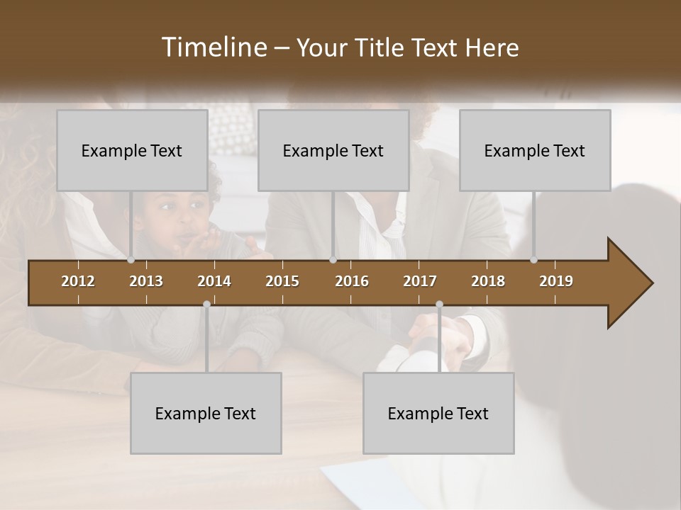 A Group Of People Sitting Around A Wooden Table PowerPoint Template