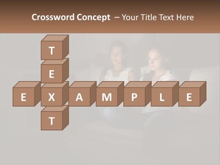 Two Girls Sitting On A Couch Watching A Movie PowerPoint Template