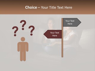 Two Girls Sitting On A Couch Watching A Movie PowerPoint Template