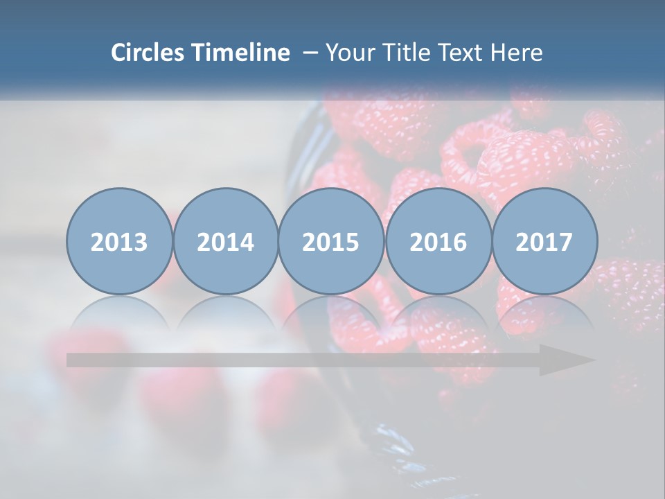 A Basket Filled With Raspberries On Top Of A Wooden Table PowerPoint Template