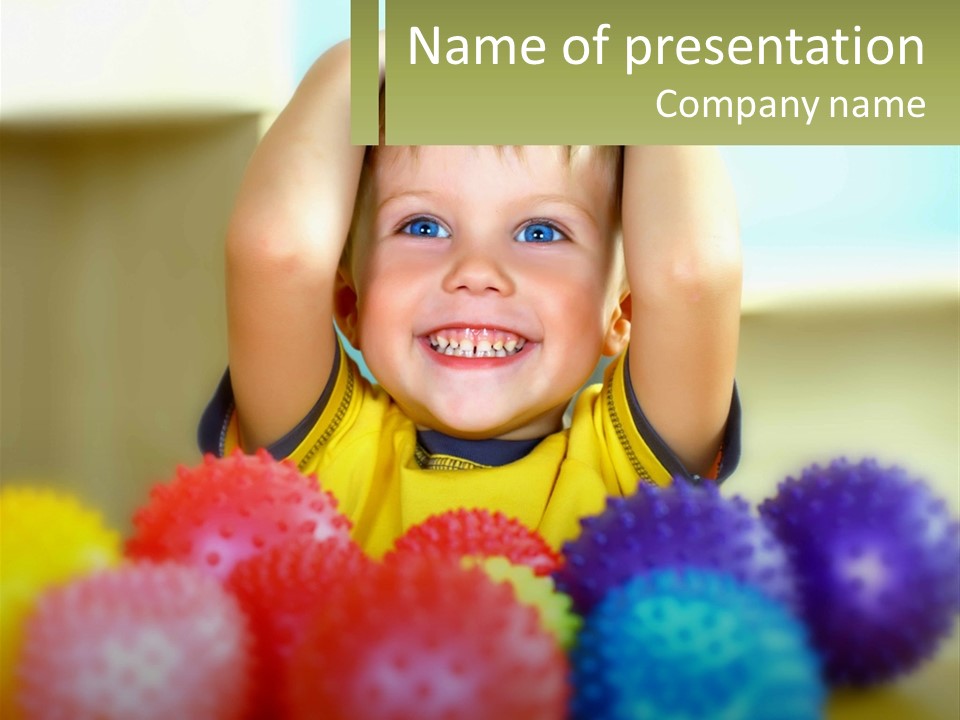 A Young Boy Is Holding His Head Above A Pile Of Balls PowerPoint Template